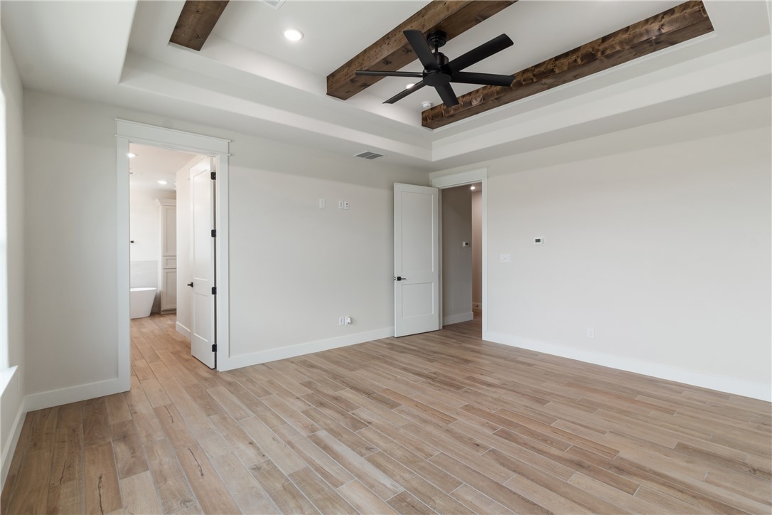 7822 Mathis Crk Drive Bryan, TX 77808 - Photo 18 of 43 wooden floor in an empty room