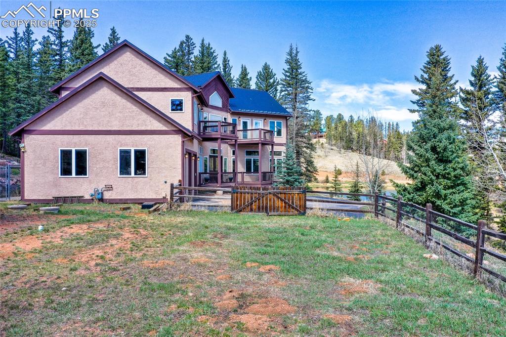 1427 Spring Valley Drive Divide, CO 80814 - Photo 14 of 50 a view of a house with a yard