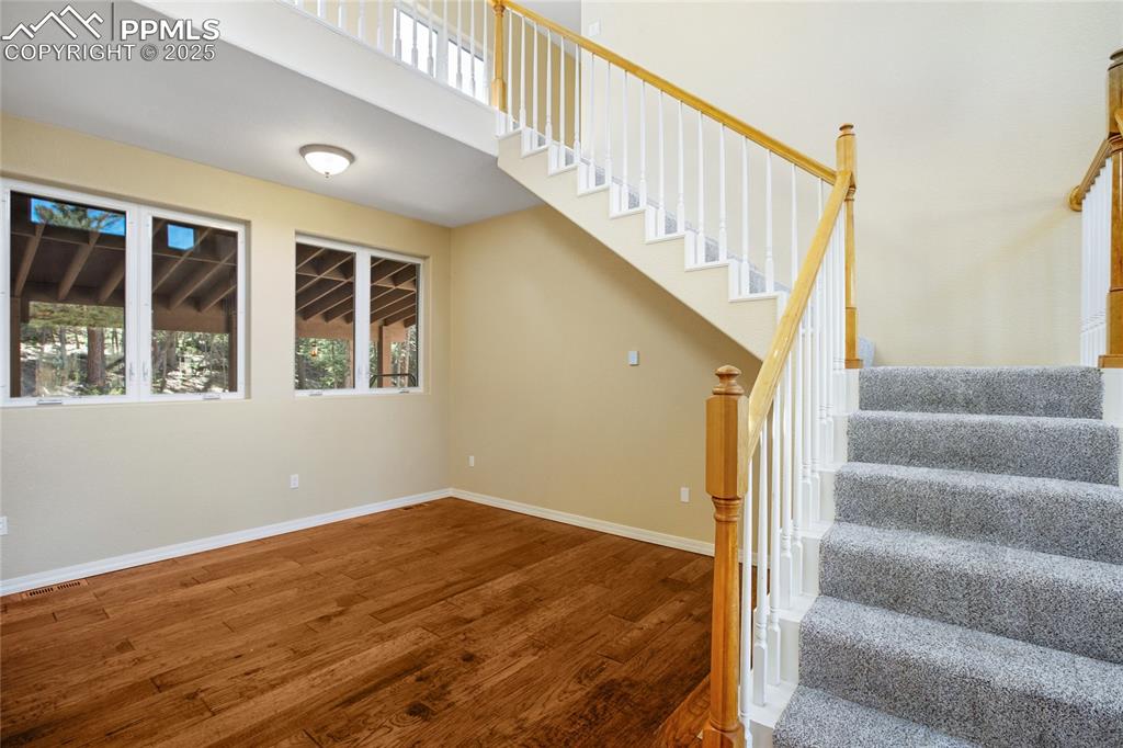 1427 Spring Valley Drive Divide, CO 80814 - Photo 23 of 50 a view of staircase with wooden floor and white walls