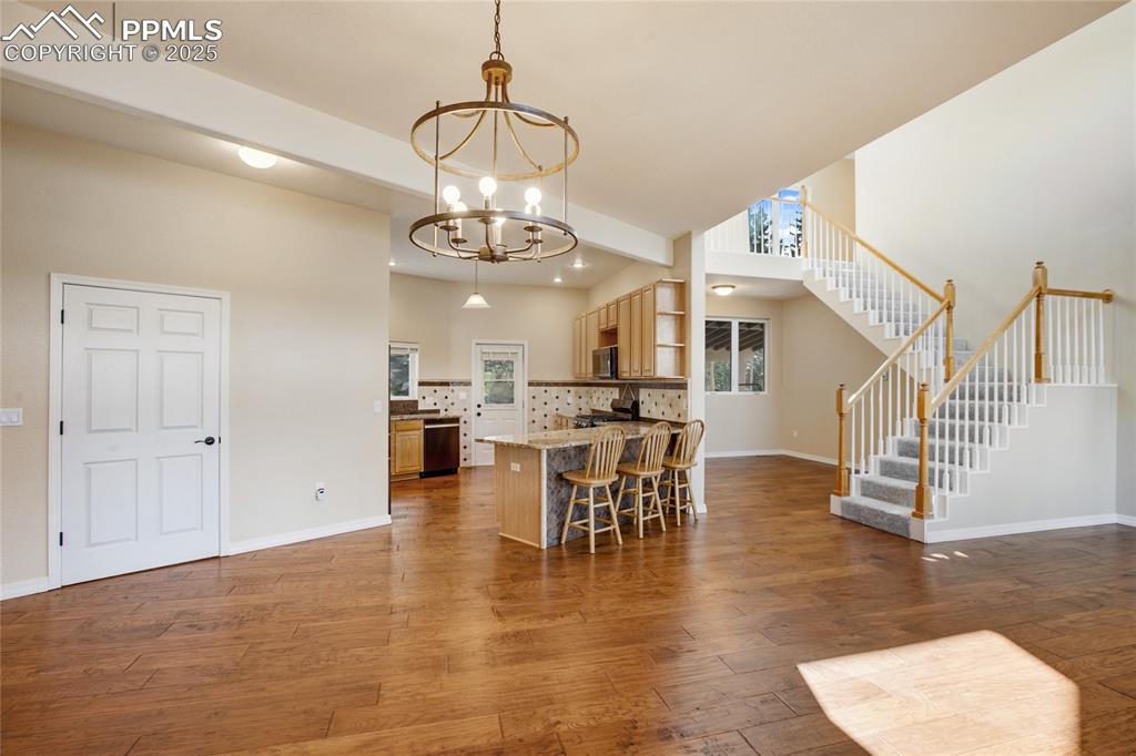 1427 Spring Valley Drive Divide, CO 80814 - Photo 24 of 50 a view of a dining room and livingroom with furniture wooden floor a chandelier