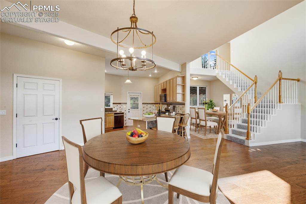 1427 Spring Valley Drive Divide, CO 80814 - Photo 25 of 50 a view of a dining room with furniture and wooden floor