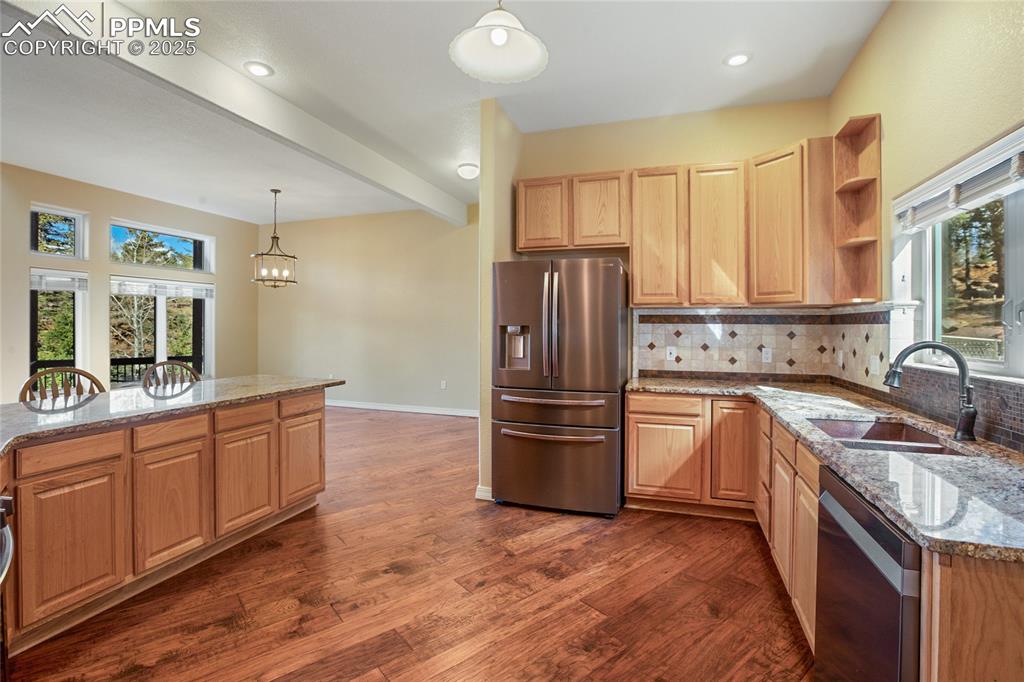 1427 Spring Valley Drive Divide, CO 80814 - Photo 27 of 50 a kitchen with stainless steel appliances granite countertop a refrigerator sink and stove