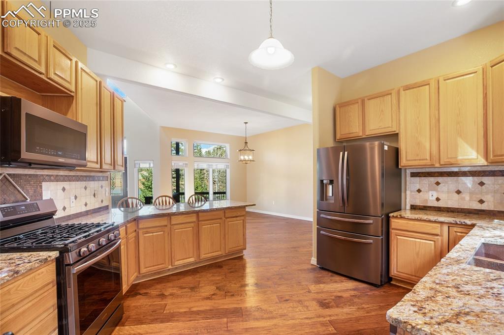 1427 Spring Valley Drive Divide, CO 80814 - Photo 28 of 50 a kitchen with stainless steel appliances granite countertop a refrigerator stove and sink