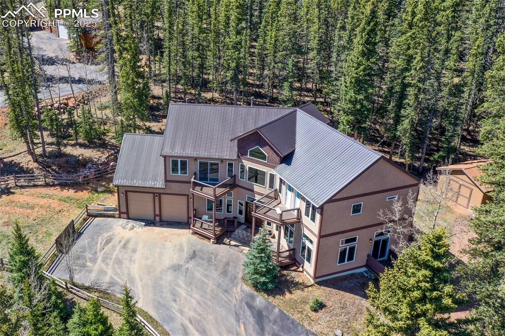 1427 Spring Valley Drive Divide, CO 80814 - Photo 48 of 50 a aerial view of a house with yard and sitting area