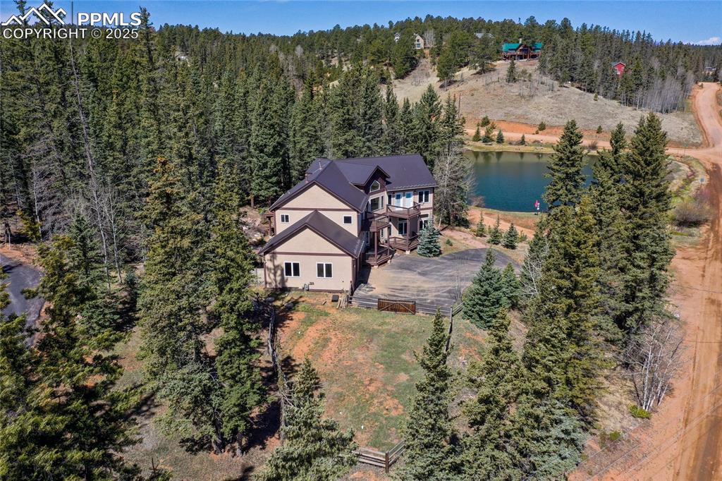 1427 Spring Valley Drive Divide, CO 80814 - Photo 8 of 50 an aerial view of a house with a yard basket ball court and outdoor seating