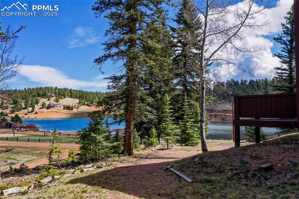 1427 Spring Valley Drive Divide, CO 80814 - Photo 9 of 50 a view of a lake with a building in the background
