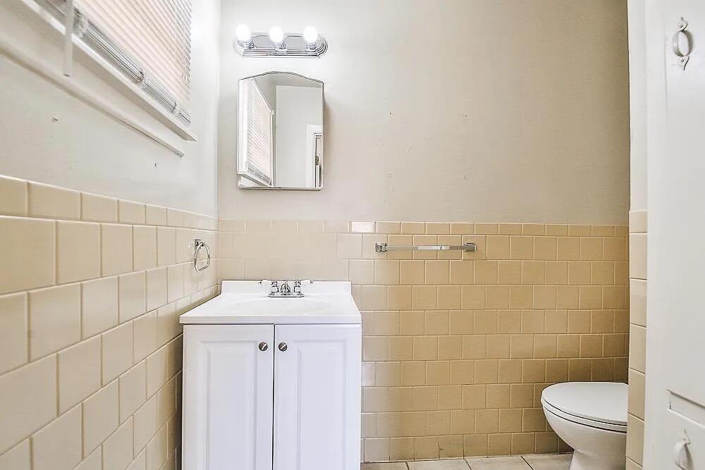 2714 40th Street Lubbock, TX 79413 - Photo 13 of 14 a bathroom with a sink toilet and shower