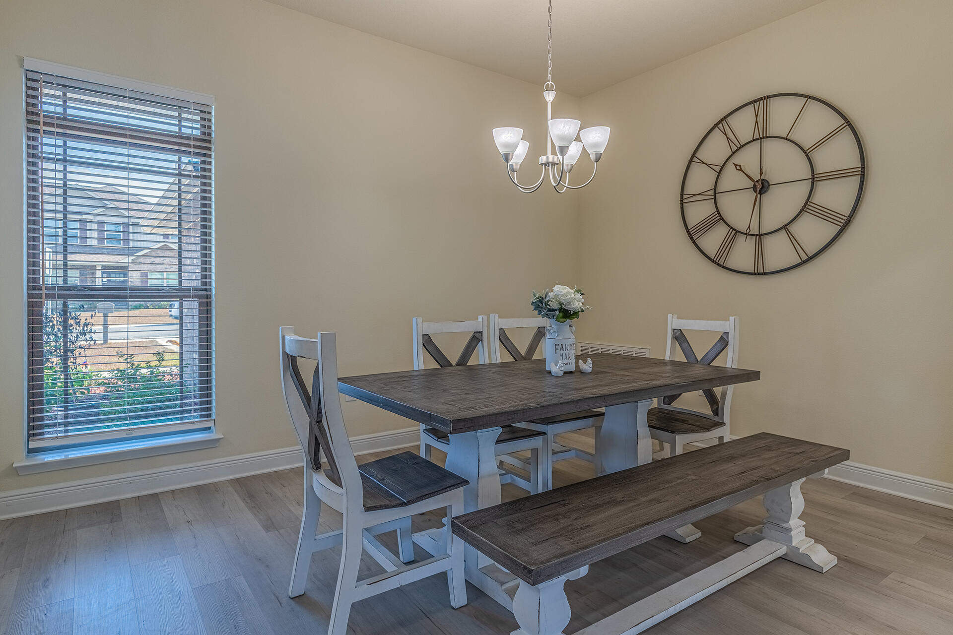 3639 Ranch Drive Crestview, FL 32539 - Photo 20 of 40 a view of a dining room with furniture a chandelier and wooden floor
