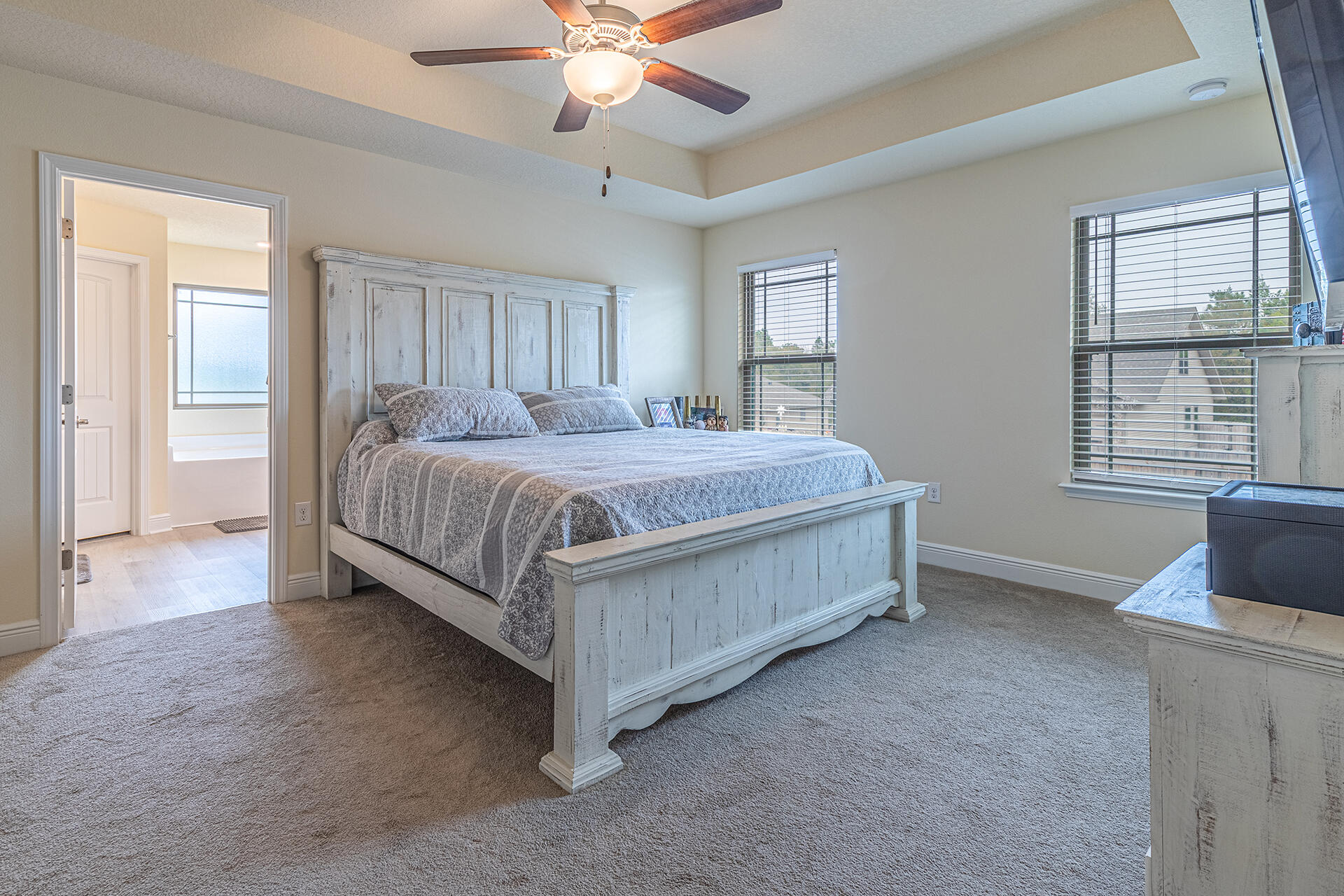 3639 Ranch Drive Crestview, FL 32539 - Photo 24 of 40 a bedroom with a bed and a chandelier