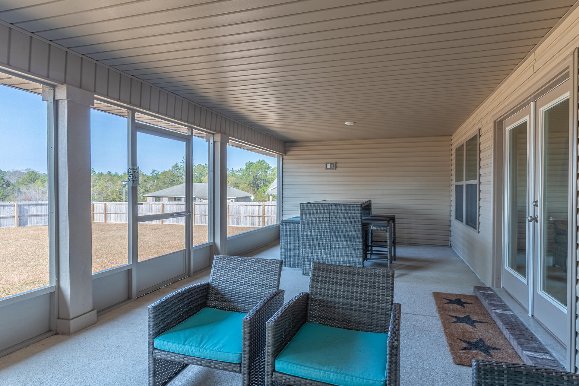 3639 Ranch Drive Crestview, FL 32539 - Photo 33 of 40 a living room with furniture and a floor to ceiling window