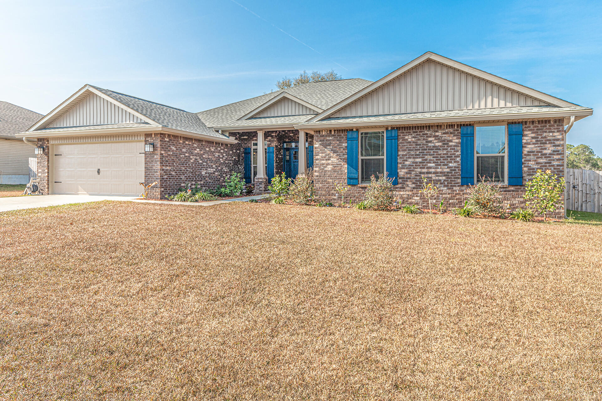 3639 Ranch Drive Crestview, FL 32539 - Photo 40 of 40 a front view of a house with a yard and garage