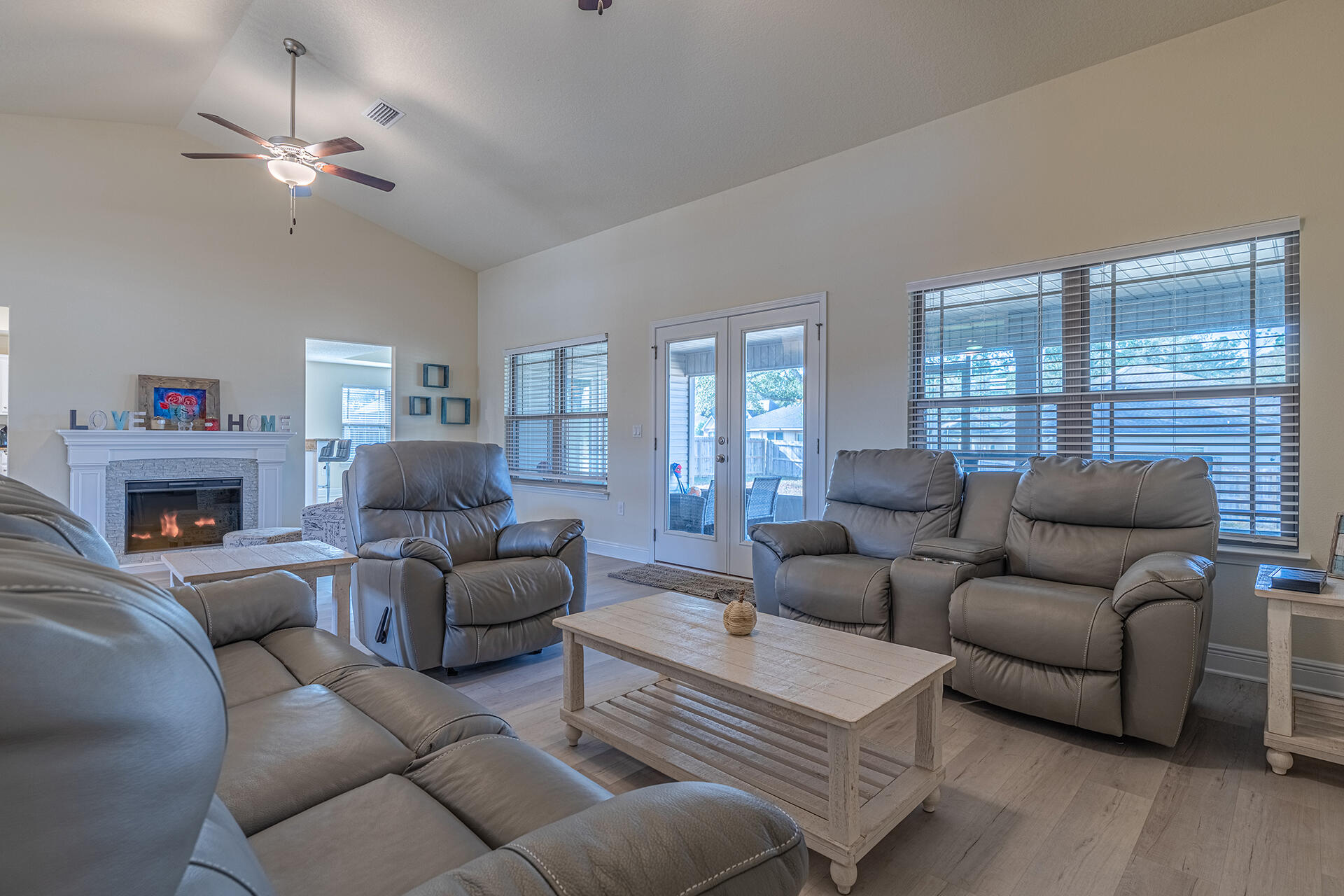 3639 Ranch Drive Crestview, FL 32539 - Photo 8 of 40 a living room with furniture a fireplace and a window