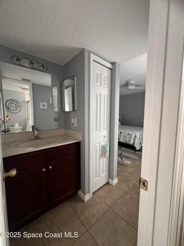 a spacious bathroom with a sink and a mirror
