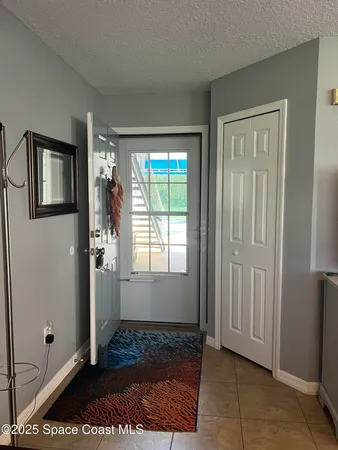a living room with furniture rug and window