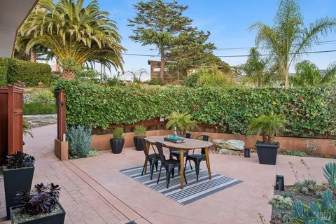 a patio with table and chairs