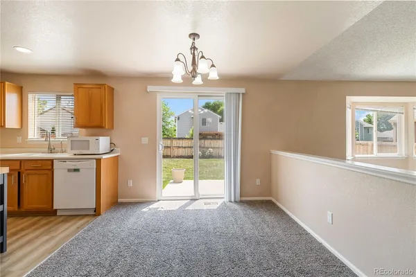 a view of a kitchen with a sink and a window