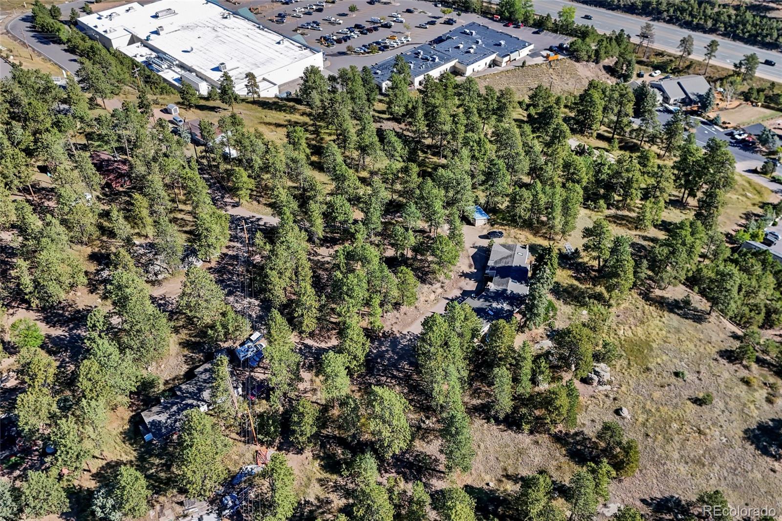 3942 Palo Verde Road Evergreen, CO 80439 - Photo 33 of 41 an aerial view of residential house with parking and yard