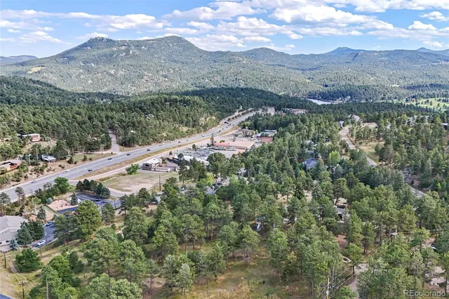 a view of a town with mountains in the background