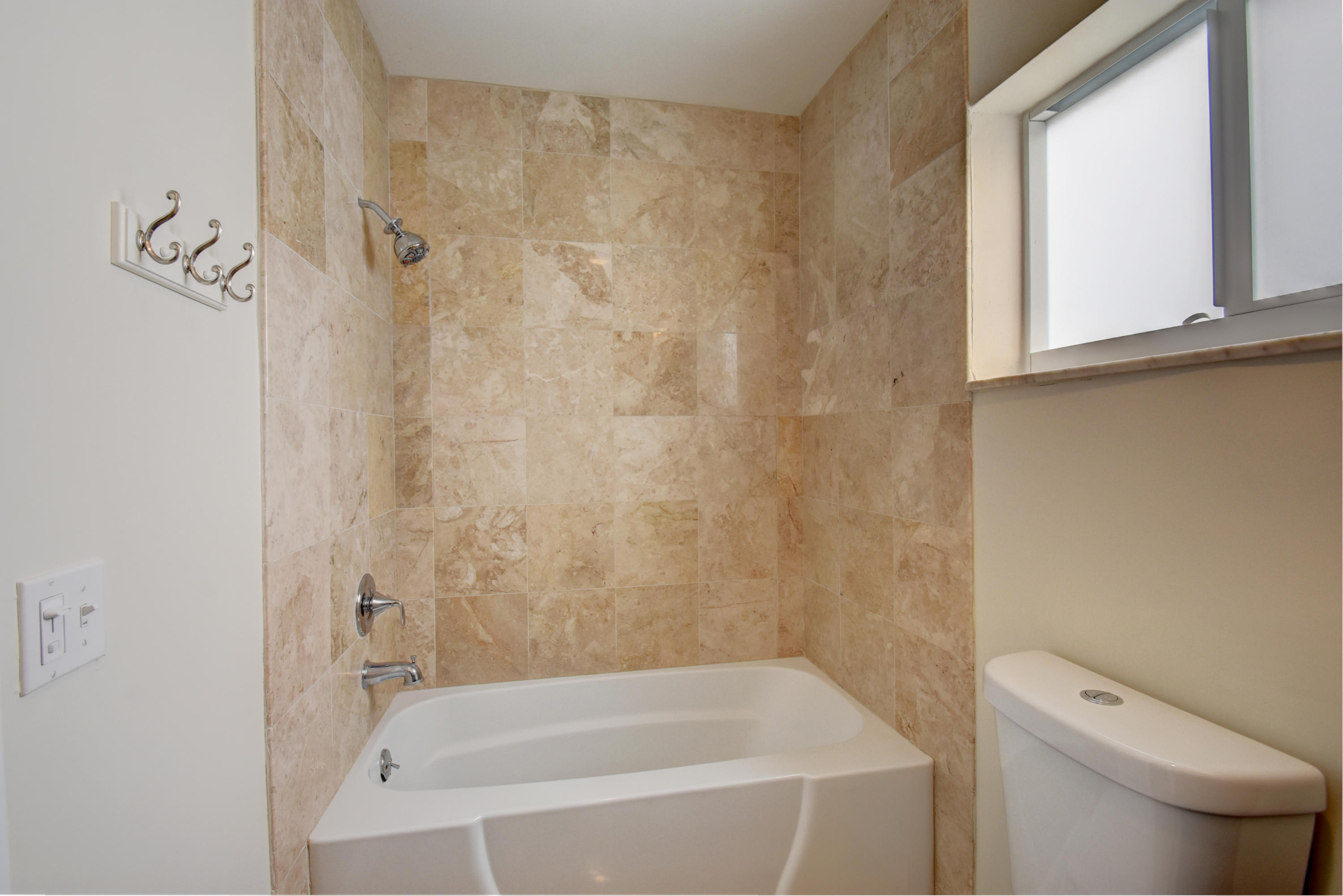 1266 Southwest 5th Street Boca Raton, FL 33486 - Photo 20 of 30 a bathroom with a bathtub and a toilet
