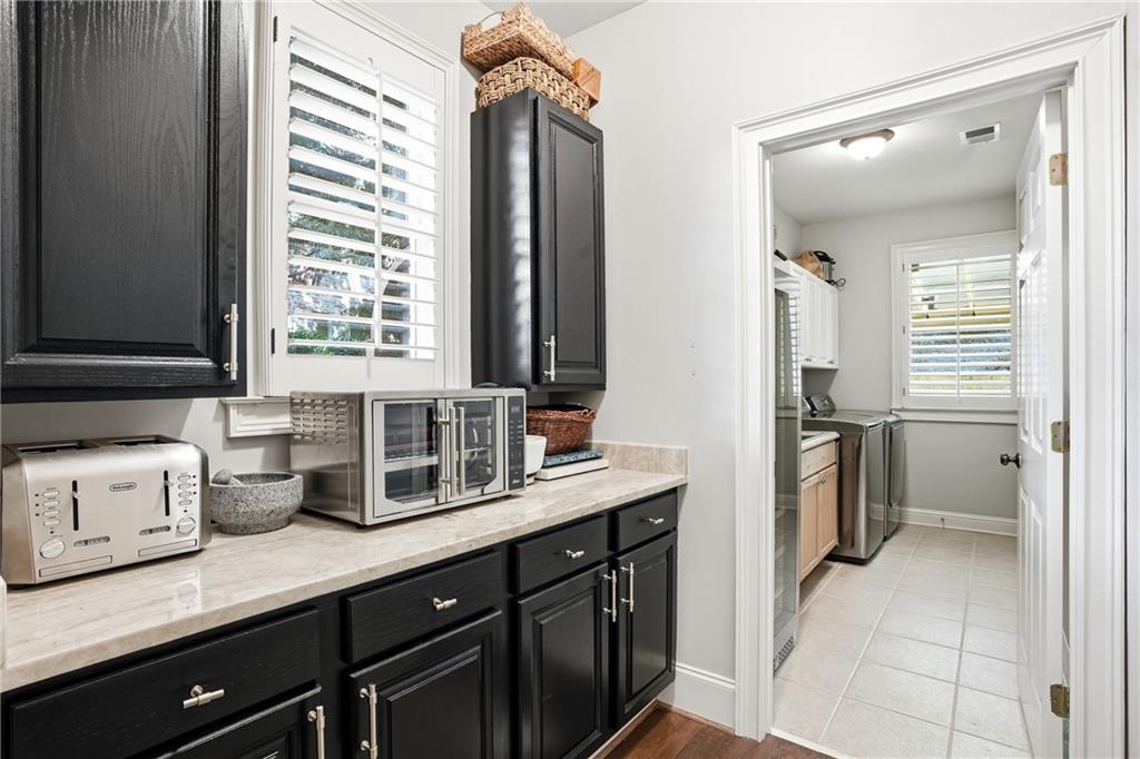 3211 Collier Gate Court Smyrna, GA 30080 - Photo 11 of 40 a kitchen with a sink stove and cabinets