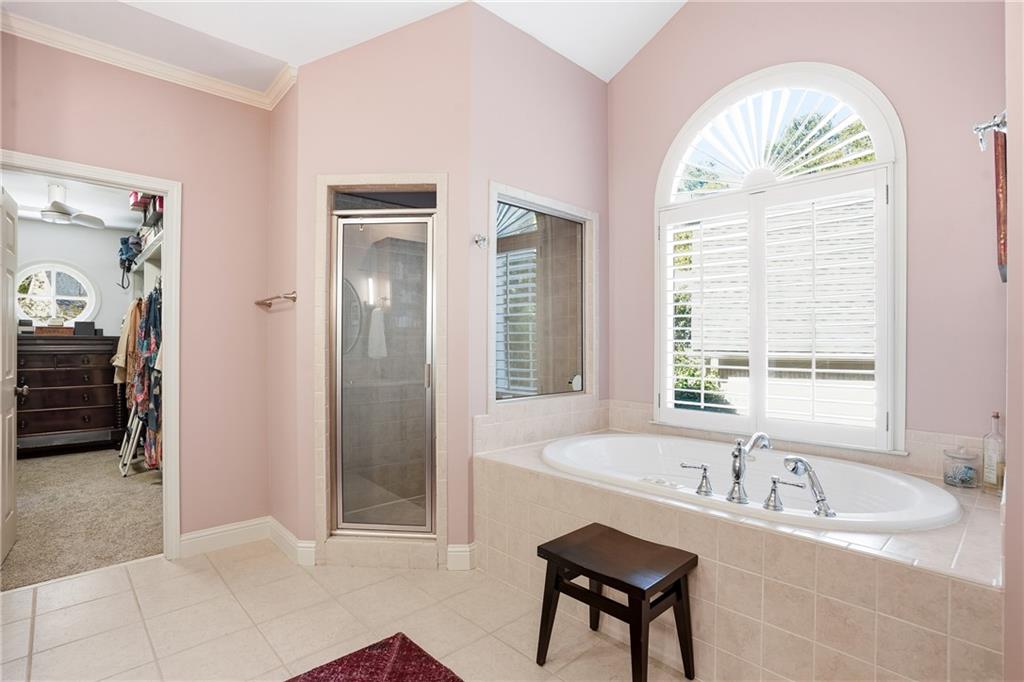 3211 Collier Gate Court Smyrna, GA 30080 - Photo 21 of 40 a spacious bathroom with a tub and a sink