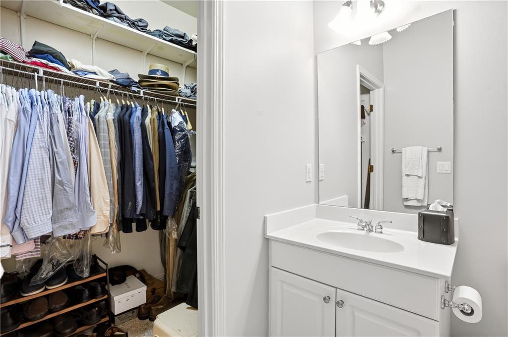 3211 Collier Gate Court Smyrna, GA 30080 - Photo 33 of 40 a bathroom with a sink mirror and a shower