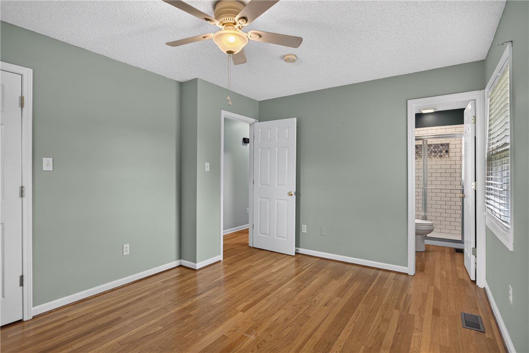 113 Greenfield Avenue Pendleton, SC 29670 - Photo 16 of 40 Hardwood flooring extends throughout this naturally illuminated bedroom with a ceiling fan for comfort.