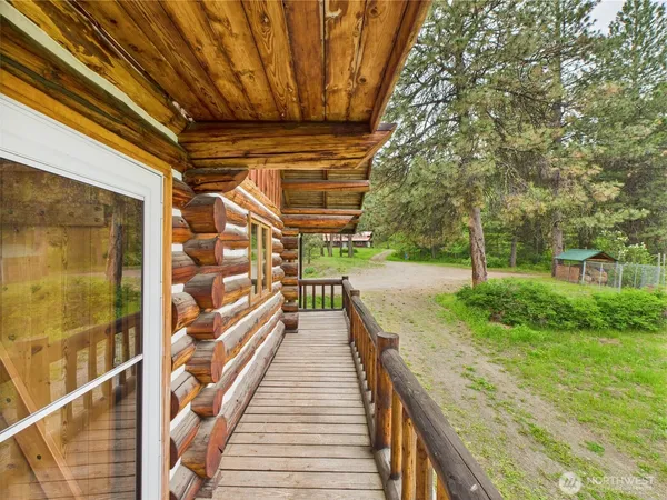 a view of outdoor space with wooden floor and outdoor seating
