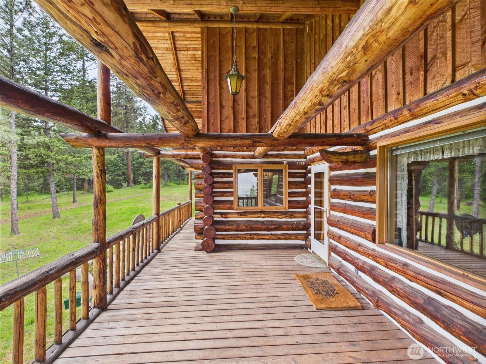 98 Tall Timber Lane Republic, WA 99166 - Photo 22 of 30 a view of outdoor space with wooden floor and outdoor seating