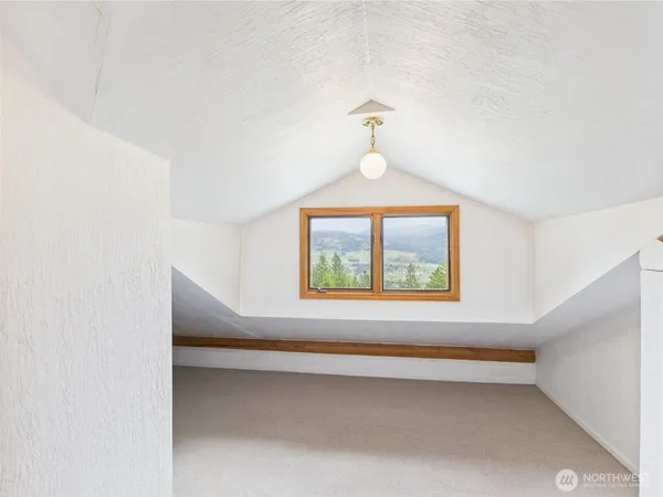 a room with furniture and a window