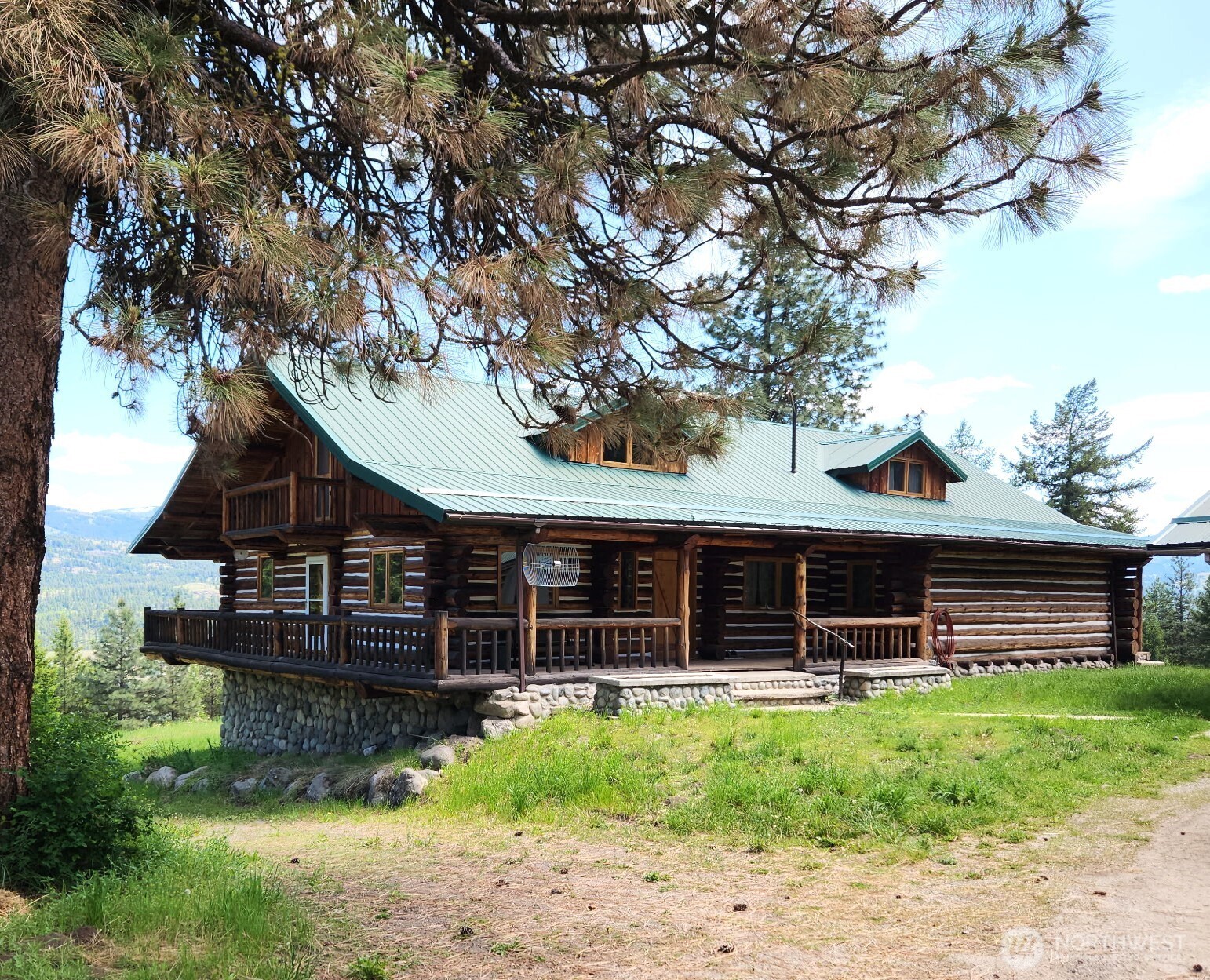 98 Tall Timber Lane Republic, WA 99166 - Photo 3 of 30 a front view of a house with a garden