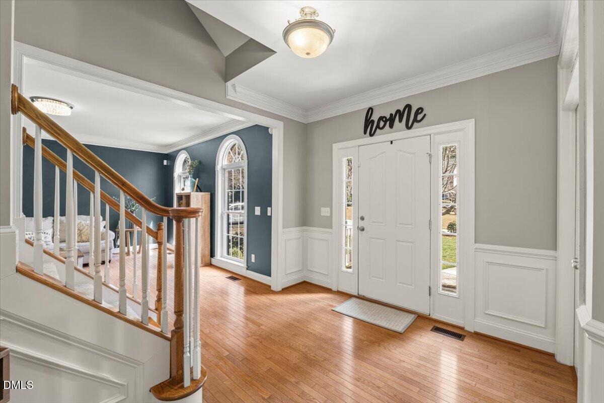 7828 Percussion Drive Apex, NC 27539 - Photo 11 of 88 a view of an entryway with wooden floor