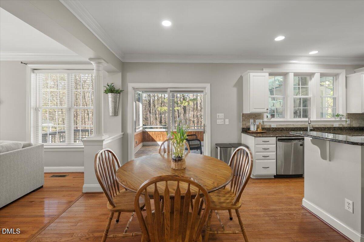 7828 Percussion Drive Apex, NC 27539 - Photo 18 of 88 a view of a dining room with furniture window and outside view