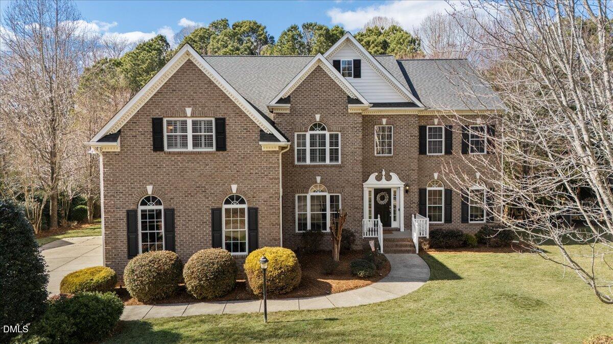7828 Percussion Drive Apex, NC 27539 - Photo 2 of 88 a front view of a house with garden