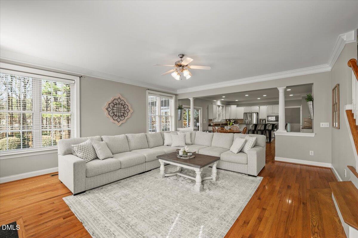 7828 Percussion Drive Apex, NC 27539 - Photo 30 of 88 a living room with furniture and a wooden floor