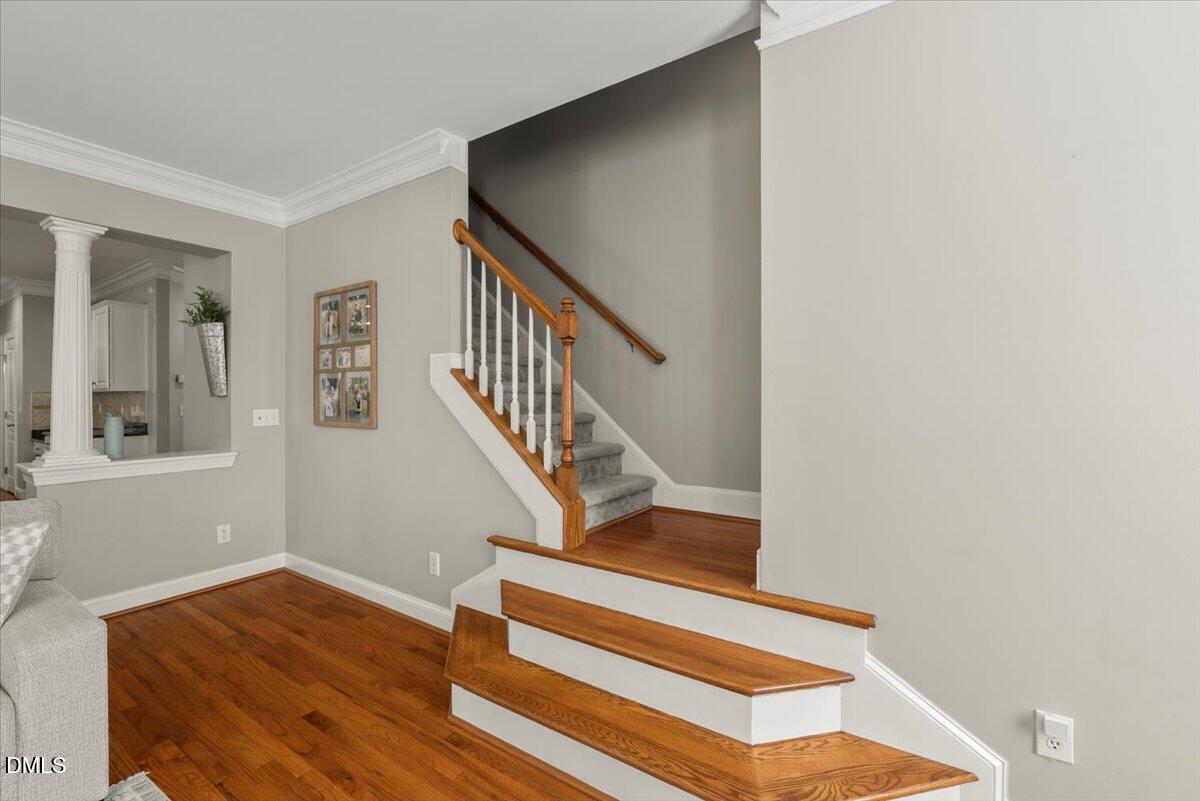 7828 Percussion Drive Apex, NC 27539 - Photo 34 of 88 a view of entryway and hall with wooden floor