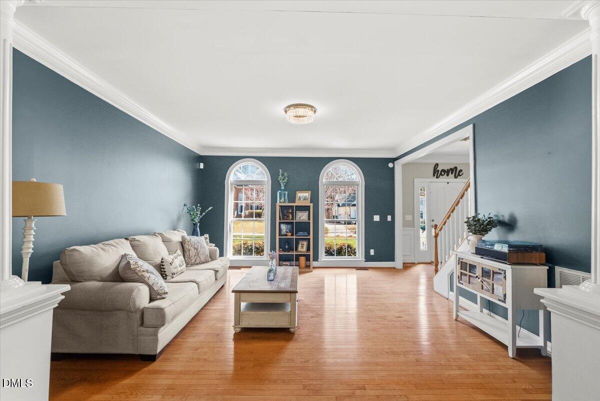 7828 Percussion Drive Apex, NC 27539 - Photo 37 of 88 a living room with furniture and wooden floor