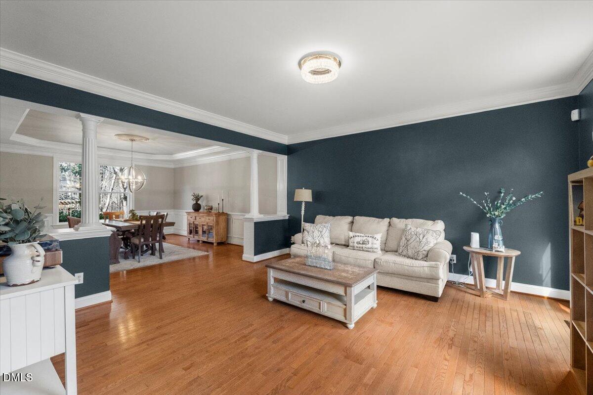 7828 Percussion Drive Apex, NC 27539 - Photo 39 of 88 a living room with furniture and wooden floor