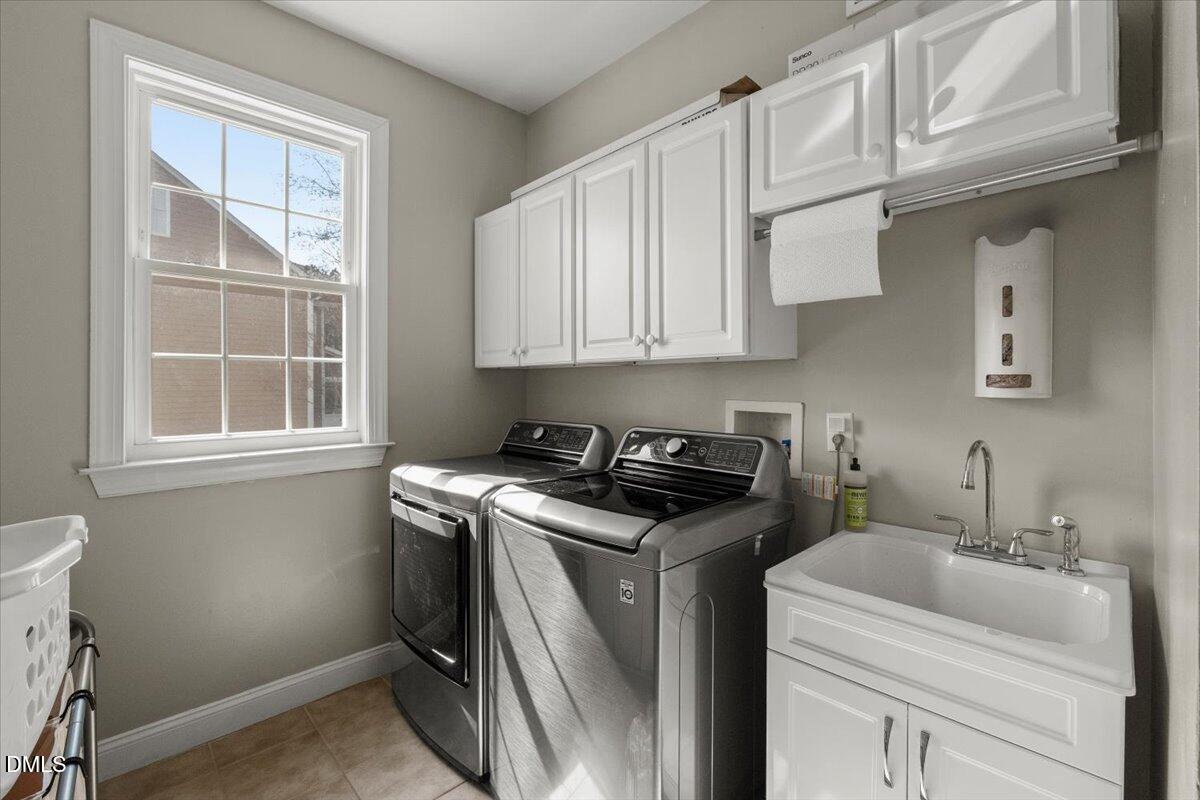 7828 Percussion Drive Apex, NC 27539 - Photo 40 of 88 a view of a kitchen with sink and cabinets
