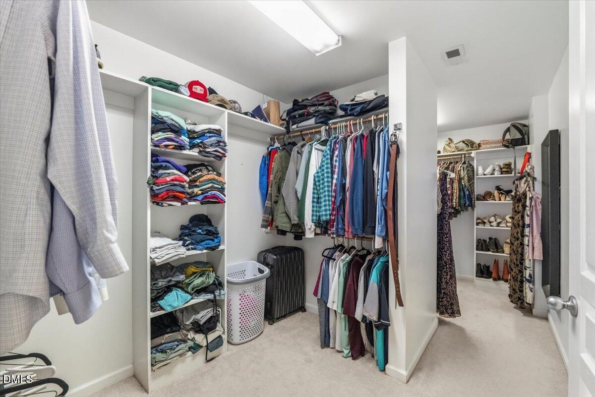 7828 Percussion Drive Apex, NC 27539 - Photo 52 of 88 a view of walk in closet with clothes