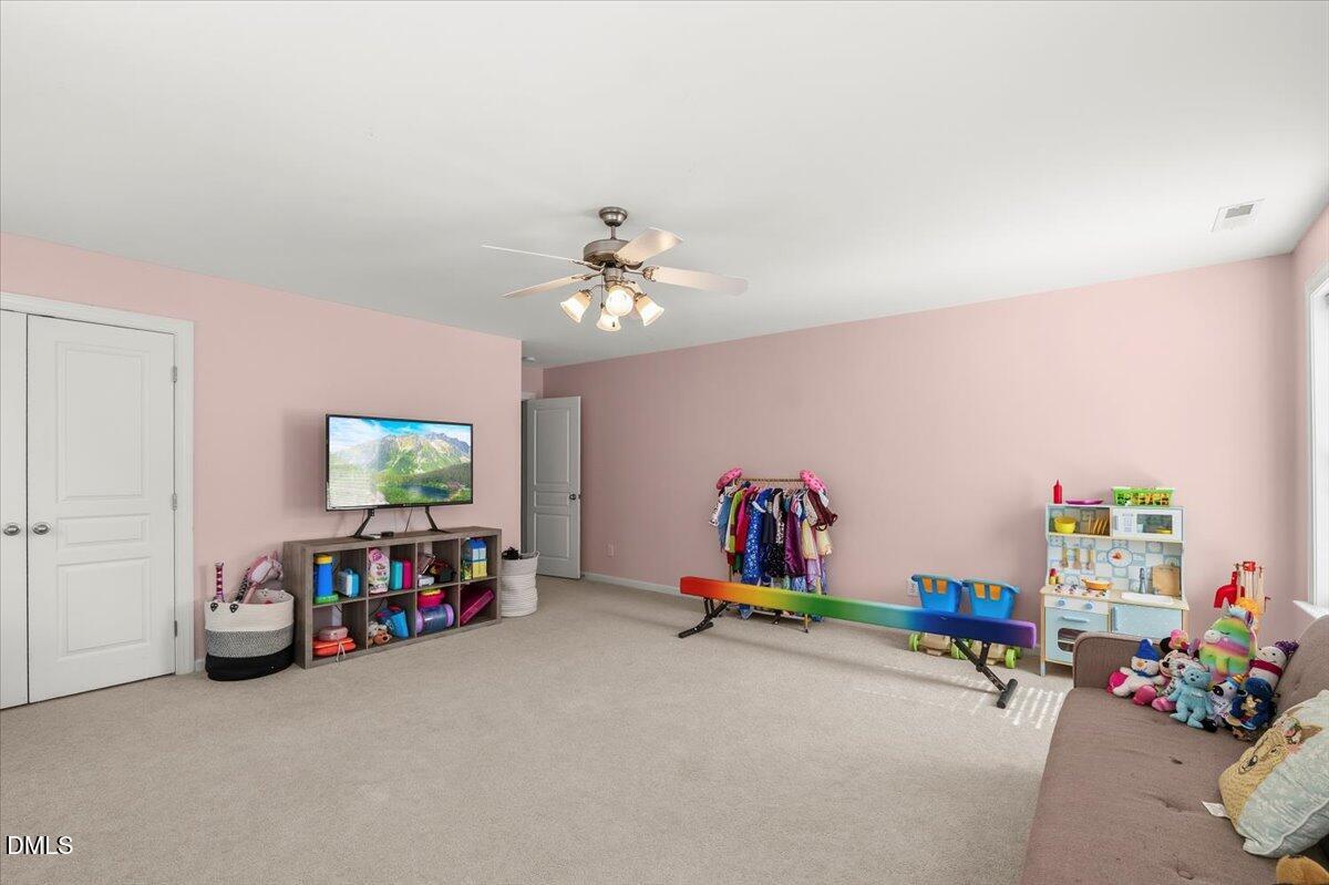 7828 Percussion Drive Apex, NC 27539 - Photo 54 of 88 a view of a room with toys