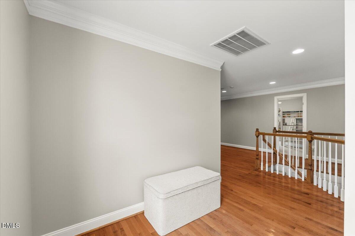 7828 Percussion Drive Apex, NC 27539 - Photo 65 of 88 a view of hallway with wooden floor