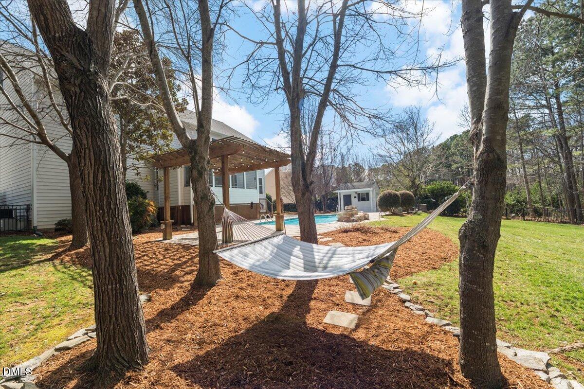 7828 Percussion Drive Apex, NC 27539 - Photo 77 of 88 a view of a swimming pool with a patio