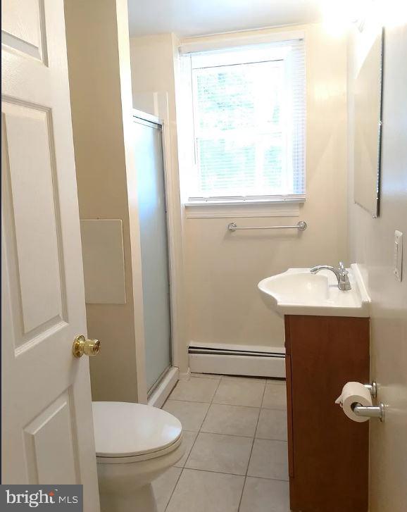 6545 Grays Mill Road, Unit 3 Warrenton, VA 20187 - Photo 8 of 8 a bathroom with a sink toilet and shower