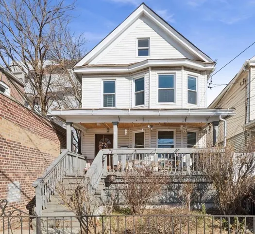 a front view of a house with large windows