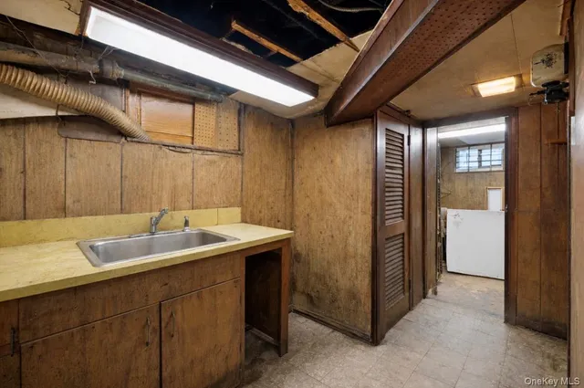a bathroom with a sink and mirror