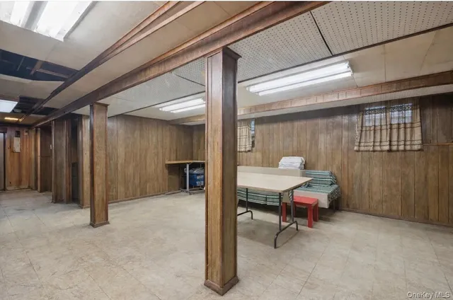 a view of a livingroom with furniture and a bathroom