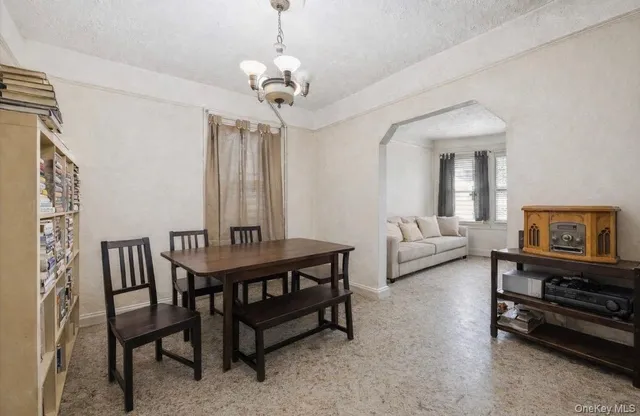 a view of a livingroom with furniture and a chandelier