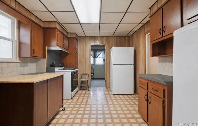 a kitchen with a refrigerator a sink and dishwasher