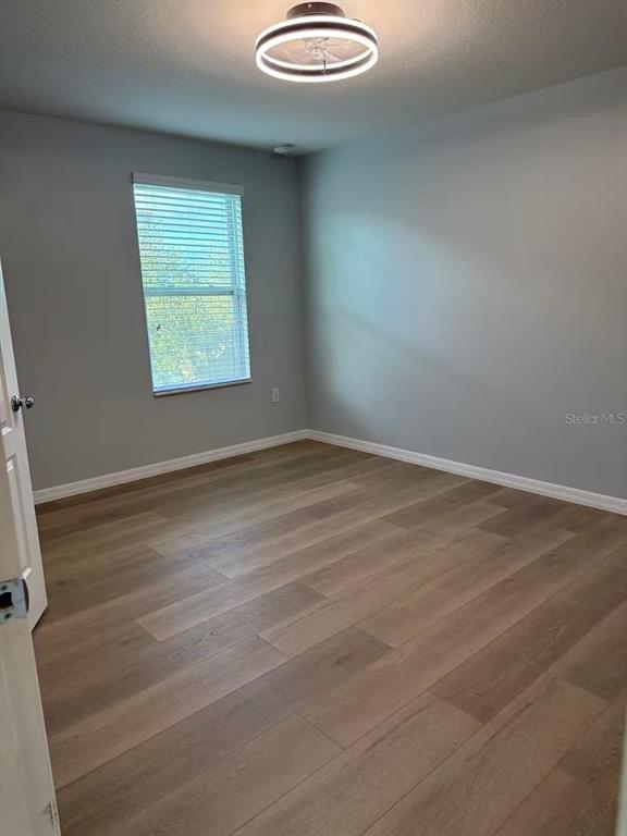 2114 Rockmart Loop Tavares, FL 32778 - Photo 11 of 18 an empty room with a window